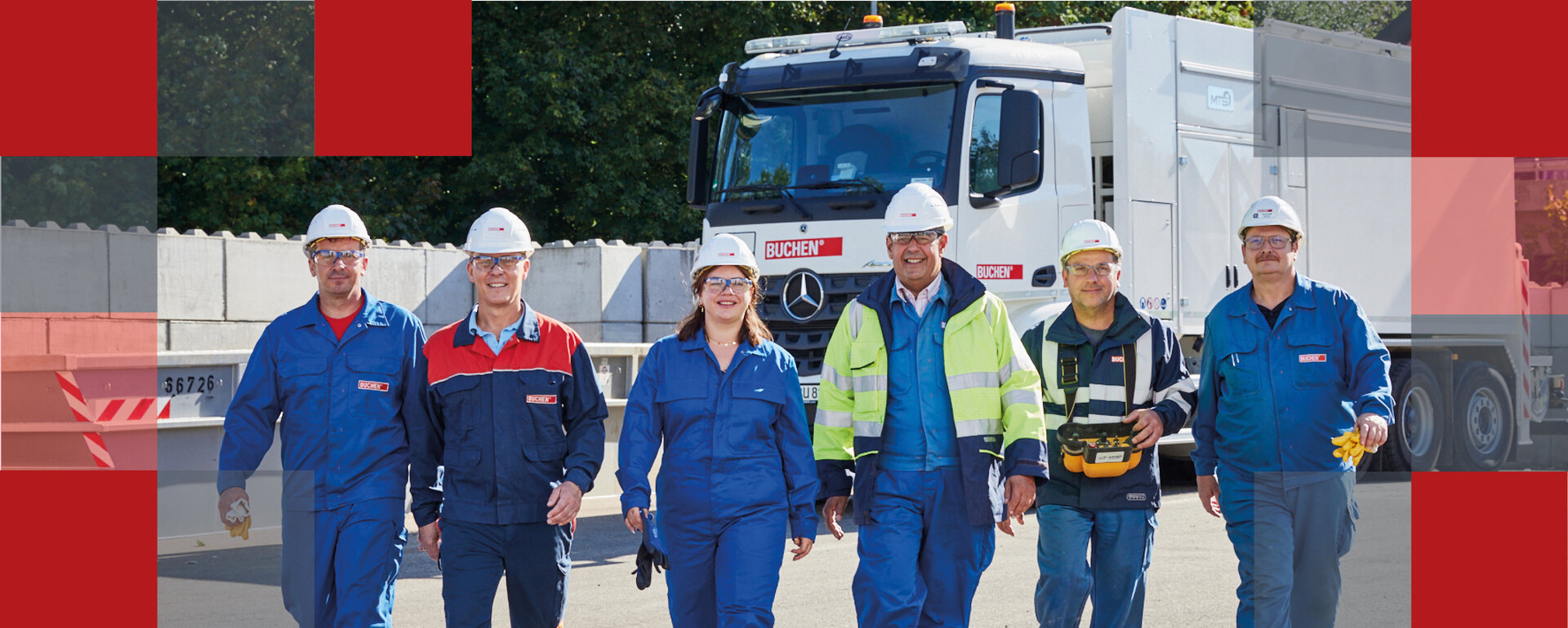 Sechs BUCHEN Mitarbeiter*innen laufen auf die Kamera zu und lächeln, im Hintergrund steht ein großes Fahrzeug